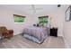 Cozy bedroom with a queen-size bed and a ceiling fan at 1600 Thomas St, Englewood, FL 34223