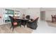 Dining area with wicker chairs and glass-top table at 1600 Thomas St, Englewood, FL 34223