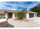 Home entrance with walkway, landscaping, and a palm tree at 1600 Thomas St, Englewood, FL 34223