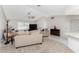 Living room with neutral furniture and a view of the kitchen at 1600 Thomas St, Englewood, FL 34223