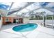 Stunning kidney-shaped pool with screened patio at 1600 Thomas St, Englewood, FL 34223