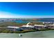 Stunning aerial view of coastal condos with waterfront access and serene turquoise waters at 1701 Beach Rd # 404, Englewood, FL 34223