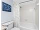 Clean white bathroom with shower/tub combination at 1701 Beach Rd # 404, Englewood, FL 34223