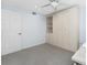 Neutral bedroom featuring a large wardrobe and a gray carpet at 1701 Beach Rd # 404, Englewood, FL 34223