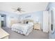 Serene main bedroom features a queen bed, soothing colors, and balcony access at 1701 Beach Rd # 404, Englewood, FL 34223