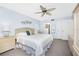 Comfortable main bedroom with nautical decor, large bed, and ensuite bathroom at 1701 Beach Rd # 404, Englewood, FL 34223