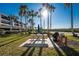 Outdoor picnic area with a picnic table and grill with lush tropical landscaping at 1701 Beach Rd # 404, Englewood, FL 34223