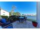 Private patio with table and chairs, overlooking the lake at 1783 Lake Pl # 1783A, Venice, FL 34293