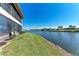 Scenic waterfront view of canal with lush green grass at 1783 Lake Pl # 1783A, Venice, FL 34293