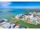 Aerial view of waterfront home with private dock and lush landscaping at 1901 Illinois Ave, Englewood, FL 34224