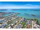 Wide aerial view showcasing waterfront property and surrounding homes at 1901 Illinois Ave, Englewood, FL 34224