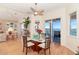 Elegant dining area with hardwood floors and access to balcony and water views at 1901 Illinois Ave, Englewood, FL 34224