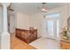 Bright entryway with hardwood floors, staircase, and natural light at 1901 Illinois Ave, Englewood, FL 34224