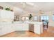 Bright kitchen with white cabinets, quartz countertops and water views at 1901 Illinois Ave, Englewood, FL 34224