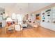 Bright living room with hardwood floors, vaulted ceilings and built-in shelving at 1901 Illinois Ave, Englewood, FL 34224