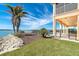 Relaxing pool area with canal view and lush landscaping at 1901 Illinois Ave, Englewood, FL 34224