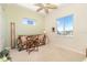 Cozy sitting room with sofa, carpet, and window with water view at 1901 Illinois Ave, Englewood, FL 34224