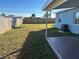 Large grassy backyard with a wooden fence at 21179 Glendale Ave, Port Charlotte, FL 33952