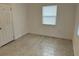 Simple bedroom with closet and terrazzo flooring at 21179 Glendale Ave, Port Charlotte, FL 33952