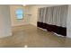 Bright living room with a window and terrazzo flooring at 21179 Glendale Ave, Port Charlotte, FL 33952