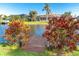 Serene backyard oasis with a private dock, offering picturesque views and water access at 214 W Pine Valley Ln, Rotonda West, FL 33947