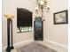 Corner dining area with a decorative chandelier and display cabinet at 214 W Pine Valley Ln, Rotonda West, FL 33947