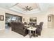 Relaxing living room with sliding doors opening to the pool area at 214 W Pine Valley Ln, Rotonda West, FL 33947