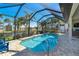 Relaxing screened pool and patio area, perfect for outdoor entertaining at 214 W Pine Valley Ln, Rotonda West, FL 33947