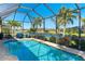 This relaxing screened pool and patio area is perfect for outdoor living at 214 W Pine Valley Ln, Rotonda West, FL 33947