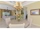 Well-lit dining room with a chandelier and views to the living room at 2619 Myakka Marsh Ln, Port Charlotte, FL 33953