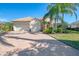 Two-story house with a two-car garage and manicured lawn at 2619 Myakka Marsh Ln, Port Charlotte, FL 33953