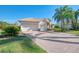 House exterior showcasing a two-car garage and well-maintained landscaping at 2619 Myakka Marsh Ln, Port Charlotte, FL 33953