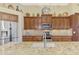 Well-equipped kitchen with granite countertops and custom cabinetry at 2619 Myakka Marsh Ln, Port Charlotte, FL 33953