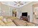 Bright living room with sectional sofa and views to other rooms at 2619 Myakka Marsh Ln, Port Charlotte, FL 33953