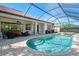 Resort-style pool and spa with covered patio and outdoor seating at 2619 Myakka Marsh Ln, Port Charlotte, FL 33953