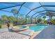 Relax and soak up the sun by the pool and spa with screened enclosure at 2619 Myakka Marsh Ln, Port Charlotte, FL 33953