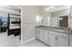 Double vanity bathroom with granite countertop and modern cabinets at 26744 Weiskopf Dr, Englewood, FL 34223