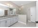 Double vanity bathroom with granite countertop and walk-in shower at 26744 Weiskopf Dr, Englewood, FL 34223