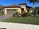 Beautiful home with landscaped yard and paver driveway at 26744 Weiskopf Dr, Englewood, FL 34223