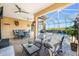 Spacious patio with pool view, seating, and dining areas at 26744 Weiskopf Dr, Englewood, FL 34223