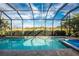 Inviting pool and spa with screened enclosure at 26744 Weiskopf Dr, Englewood, FL 34223