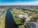 Aerial view showing home's location and large backyard at 276 Long Meadow Ln, Rotonda West, FL 33947