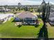 Aerial view of home with pool and canal-front lot at 276 Long Meadow Ln, Rotonda West, FL 33947