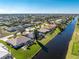 Aerial view of canal-front properties and lush landscape at 276 Long Meadow Ln, Rotonda West, FL 33947