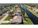 Aerial view showcasing home's backyard and pool at 276 Long Meadow Ln, Rotonda West, FL 33947