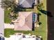 Bird's-eye view of house, pool, and canal at 276 Long Meadow Ln, Rotonda West, FL 33947