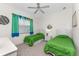 Guest bedroom with twin beds and cheerful decor at 276 Long Meadow Ln, Rotonda West, FL 33947