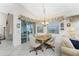 Kitchen breakfast nook with table and chairs, overlooking the pool area at 276 Long Meadow Ln, Rotonda West, FL 33947