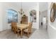 Formal dining room with a chandelier and wooden furniture at 276 Long Meadow Ln, Rotonda West, FL 33947