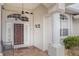 Inviting front entrance with a brown door and tiled flooring at 276 Long Meadow Ln, Rotonda West, FL 33947